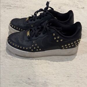Nike Air Jordan Black Sneakers with Gold Star Accents
